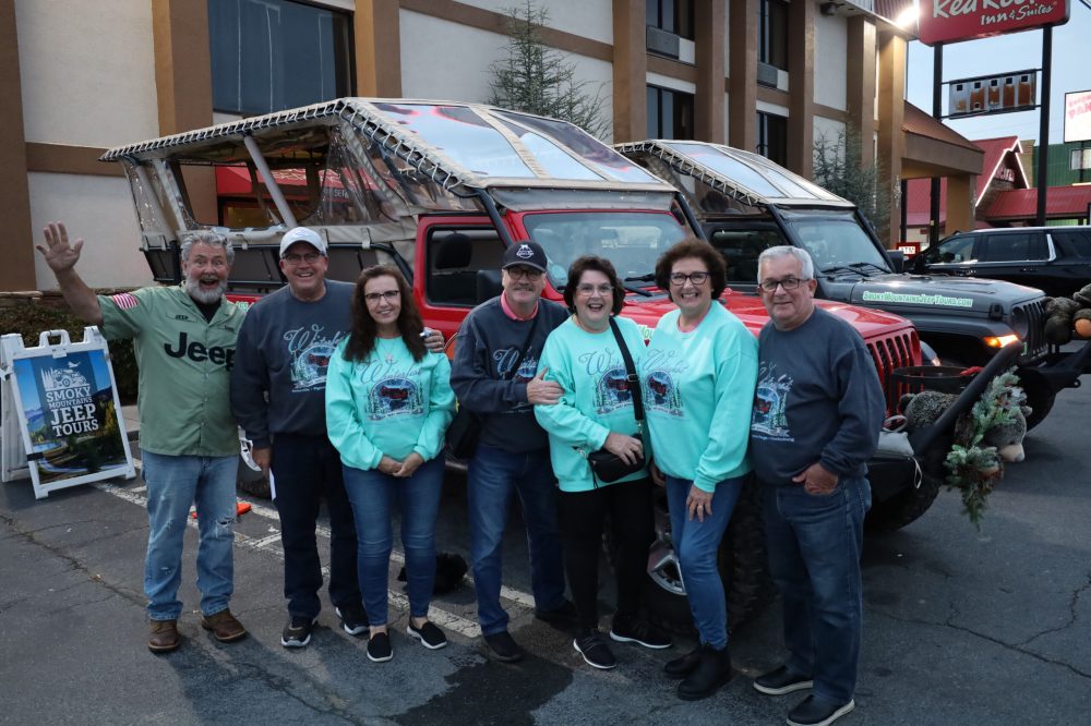 a group of people standing in front of a building